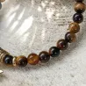 Bracelet en Œil de Tigre et Acier Doré – Libellule