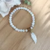 ✨ Bracelet en Nacre avec Breloque Plume